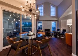 For large living rooms, create the perfect seating arrangement with a mixture of lounge chairs, rocking chairs, and modern sectional sofas. Interior Design Kelowna Mid Century Condo Creative Touch Interiors Inc