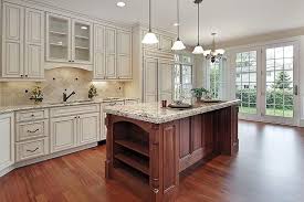 Beautiful Country Kitchen With Off White Raised Panel Cabinet Doors And Brown Stained Island Luxurykitche Luxury Kitchen Island Luxury Kitchens Luxury Kitchen