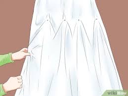 The drama created by these bustles often draws brides to choose them for their wedding gown. 3 Ways To Bustle A Wedding Dress Wikihow