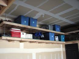 Tuck medium and lightweight stuff onto shelves suspended from the ceiling. Diy Overhead Garage Storage Shelves Diy Overhead Garage Storage Overhead Garage Storage Garage Storage
