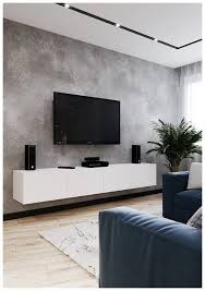 It has a leather wingback chair and curved sectional surrounding the wooden coffee table on a beige textured rug. 35 Best Tv Wall Designs And Ideas Fashionova Us Living Room Decor Apartment Small Living Rooms Minimalist Living Room
