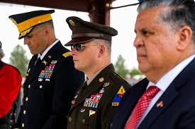 The command team, Lt. Col. Mark McClellan and Command Sgt. Maj. Aaron  Whitham, and Soldiers of 1st Battalion, 77th Armored Regiment, 3rd Armored  Brigade Combat Team, 1st Armored Division march in the