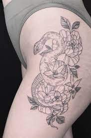 Realistic snake tattoos on ankles. Tattoo Uploaded By Yink Tattoos Large Snake Floral Piece Placed On The Thigh 1072675 Tattoodo