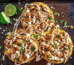 Use tongs to add a corn tortilla to the pan. How To Make Tostada Shells Mexican Please