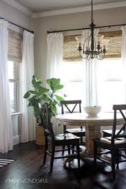Blinds Com Budget Woven Wood Shades Blinds Com In 2020 Window Treatments Living Room Dining Room Windows Farm House Living Room