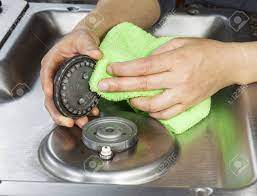 Check spelling or type a new query. Hands With Microfiber Cloth Cleaning Gas Stove Burner Cover Stock Photo Picture And Royalty Free Image Image 17155853