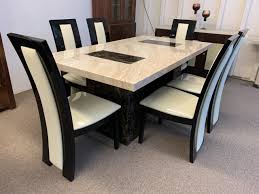 Dining room table shopping tips: Brisbane Brown And Beige 180cm Marble Table With 6x Black Straightback Chairs Designer Marble