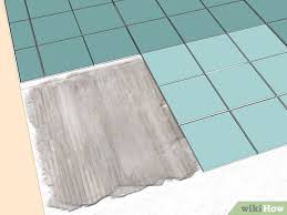 4k00.18worker with a trowel, aligns the concrete for laying the floor tile. How To Lay Tile On Concrete With Pictures Wikihow