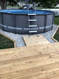 24 Above Ground Pools You Ll Want In Your Backyard Backyard Pool Landscaping Above Ground Pool Landscaping Pool Patio