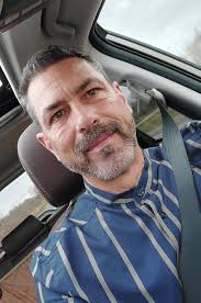 Girl peeking from trailer in Danbury, WI