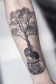 50 Gorgeous And Meaningful Tree Tattoos Inspired By Nature S Path Guitar Tattoo Design Tattoos Music Tattoo Designs