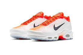 Nike S Air Max Plus Receives A White Orange Gradient Spray Makeover Nike Air Max Plus Nike Air Max Nike Air Max Tn