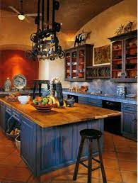 Light oak floors replaced the distressed dark ones unifying the family room and kitchen. Pin By Kimsinsen On House And Decor Mediterranean Kitchen Design Mexican Kitchen Decor Mexican Style Kitchens
