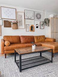 The brown couch and roaring fireplace make this living room feel wonderfully cozy. Industrial Coffee Table For Living Room Home Furniture Industrial Decor Living Room Leather Couches Living Room Living Room Leather