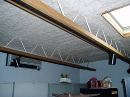 View of asbestos ceiling sytem comprising several layers of materials. Acoustic Insulation Econo Therm Insulation Company
