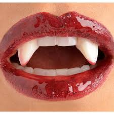 Stick them on with a bit of denture adhesive. Bloody Vampire Fangs Party City