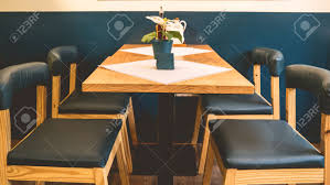 Find the dining room table and chair set that fits both your lifestyle and budget. Green Chairs And Wooden Table Simple Modern Furniture Dining Stock Photo Picture And Royalty Free Image Image 153155347
