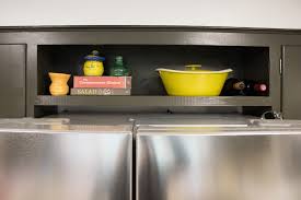Yes, there are a few wires running up from the wall which then enter the ceiling for the light fixtures, but the space needed to conceal those is only a matter of a few inches. A 21st Century Fridge In A 1950 S Kitchen Merrypad