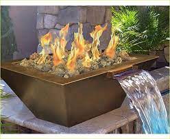 There are several versions of fire and water kits but most of those only offer the illusion of mixed elements. Hugedomains Com Fire Pit Backyard Backyard Water Feature Backyard Fire