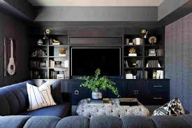 A neutral farmhouse dining area spruced up with a bright gallery wall, with a stained table and bench plus white metal chairs. 29 Beautiful Black Rooms