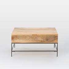 Some assembly required, available in walnut/gray. Industrial Storage Pop Up Coffee Table
