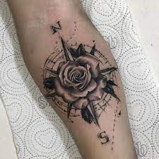 The tattoo artist cleverly added watercolor tattoo designs to this rose compass tattoo on the forearm that was fading away. Classic Black And Gray Compass And Rose Tattoo For Men Tattoosmen Tattooideasformen Tatoeage Ideeen Tatoeage Tatoeages