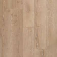 Laminate flooring is made by compressing layers of fiberboard together and placing a photographic image of wood grain, stone, or tile pattern over the fiberboard. Aquaguard Rustic Timber Water Resistant Laminate 100585231 Floor Decor Sweets