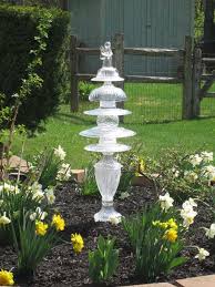 Great Use For Repurposed Glassware Glass Garden Art Garden Art Glass Garden