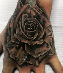 The deep red of the rose is very compelling and matches the tattoos going up the arm well. 50 Best Hand Tattoos For Men 2021 Cool Simple
