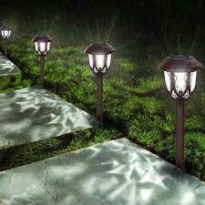 The simple path lights are mounted on stakes that can be inserted into grass or dirt, and they have a solar panel on the top that soaks up the sun during the day, allowing the light to stay bright all night long. Solar Lights Outdoor Decorative 10 Packs Solar Pathway Lights Powered Landscape Lighting Waterproof Solar Powered Garden Yard Lights For Walkway Sidewalk Driveway Cool White Amazon Com