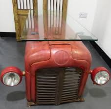 Woo goes on to suggest a variety of flat surfaces that can serve as coffee table substitutes: Coffee Table From An Upcycled Massey Ferguson Tractor Recyclart