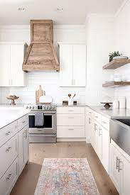 Our White Modern Farmhouse Kitchen With Custom Wood Hood And Floating Shelves M Shaker Style Kitchen Cabinets Modern Farmhouse Kitchens Shaker Style Kitchens