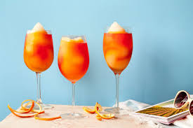 Three Frozen Aperol Spritz Slushy Drinks On A Table Aperol Aperol Spritz Frozen Drink Recipes