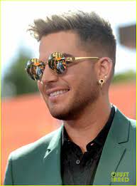 This pose is from the 20th annual aids foundation in 2012 and his tall spikes look this version is sleek and smooth with height on top and short sides. Adam Lambert Shows Off His Blonde Hair At Iheartradio Music Awards 2014 Photo 3103331 2014 Iheartradio Music Awards Adam Lambert Pictures Just Jared