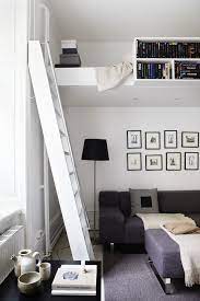 Becky had a loft bed custom made to be high enough to create a small closet space underneath, but low enough that the bed area didn't impede on any precious wall storage built in to the apartment. Pin By Julia On Home Modern Loft Bed Studio Apartment Decorating Beds For Small Rooms