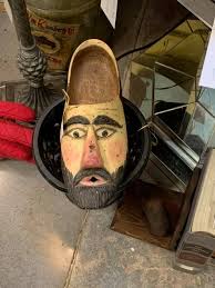 I found this at the local second hand store and I'm a bit puzzled over it's  use. It is not shaped to fit around my neck. Is it vintage or newer?