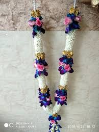 Blue Orchids And Pink Roses Weddings Garlands Flower Garland Wedding Indian Wedding Garland Indian Wedding Flowers The gota flowers on the frame and hanging roses add a touch of glamour to the otherwise simple phoolon ki chadar. flower garland wedding