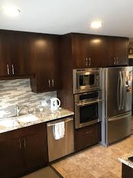 Every cabinet and countertop is custom designed and measured to your space and style to ensure efficient use and creative solutions with traditional quality and workmanship according to old world tradition. Expresso Cabinets Lightened Up With Kitchen Cabinet Spraying In Winnipeg Manitoba Recent Projects Color Scheme Professional Painters