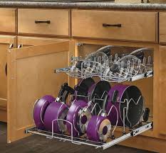 Store all of your lids in one place with this cabinet lid organizer. 11 Genius Ways To Organize Pots Pans Organization Obsessed