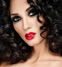 If you've got brown or black hair with a warm complexion then look for shades of red with a brown base. Look Great Red Lip Service Madonna Comadonna Co