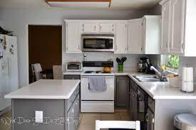 His secret to making a streamlined kitchen feel considered: Painting Cabinets White Kitchen Painted Grey And Paint Without Sanding Tee Grey Painted Kitchen Kitchen Cabinets Painted Grey Kitchen Cabinets Before And After