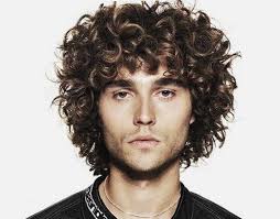 Haircuts for thick wavy hair need balance to avoid becoming too voluminous or poofing out into the notorious pyramid shape. Hairstyle For Thick Curly Hair Male Liptutor Org