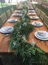 Beautiful Table Lovely Garland And Candles On Farmhouse Tables Simple And Wedding Table Decorations Centerpieces Winter Wedding Table Round Wedding Tables