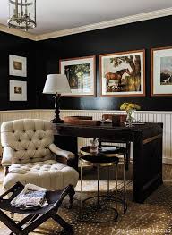An Otherwise Dark And Traditional Manly Office With Leather Wrapped Desk And Horsey Prin Masculine Home Offices House And Home Magazine Masculine Office Decor