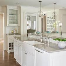 The white stone slab backsplash adds a natural element to space and gives the room an airy feel. The Case For Quartz Countertops Everyday Cheapskate