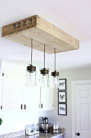 Turn Pallets Into Fabulous Farmhouse Lighting Diy Kitchen Lighting Farmhouse Kitchen Decor Farmhouse Kitchen Lighting