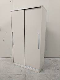 4 adjustable shelves, 48 small storage bins in the doors and a handle with key lock. Putty Metal Storage Cabinet With Sliding Doors 36 Inch Wide