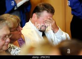 The father of defendant Aaron Deveau wipes away tears while victim impact  statements are read in Haverhill District Court in Haverhill, Mass.,  Wednesday, June 6, 2012, where Aaron Deveau was convicted