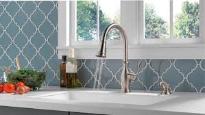 A cool fresh appeal with overtone mosiac tiles that works gloriously with the blue pearl another spanish style backsplash made of tile surrounded by leaded glass windows adds a lot of character to this colonial kitchen. 7 Kitchen Backsplash Trends To Follow Now