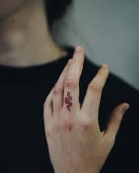 Snake tattoo on back shoulder. Only Handpoke Tattoo On Instagram Tinny Red Snake Handpoke Snaketattoo Tinnytattoo Mini Small Finger Tattoos Finger Tattoo For Women Red Tattoos